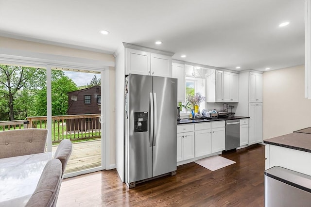 3 Bayberry Ln, Westfield, MA 01085 - kitchen featuring appliances with stainless steel finishes, dark countertops, dark wood-style flooring, white cabinets, and recessed lighting