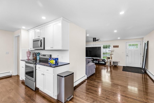 3 Bayberry Ln, Westfield, MA 01085 - kitchen featuring stainless steel appliances, a baseboard radiator, dark wood finished floors, dark countertops, and white cabinetry