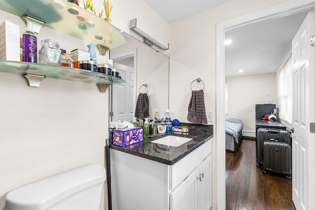 3 Bayberry Ln, Westfield, MA 01085 - half bath with wood finished floors, vanity, toilet, recessed lighting, and baseboard heating