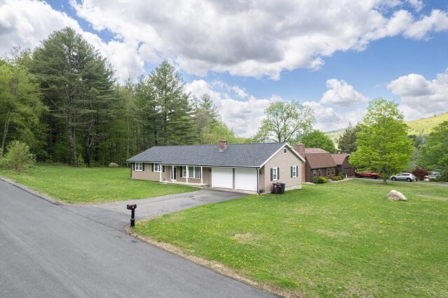 3 Bayberry Ln, Westfield, MA 01085 - ranch-style house with an attached garage, driveway, a front lawn, and a chimney