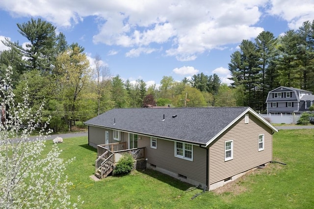 3 Bayberry Ln, Westfield, MA 01085 - rear view of house featuring a deck, a shingled roof, and a lawn