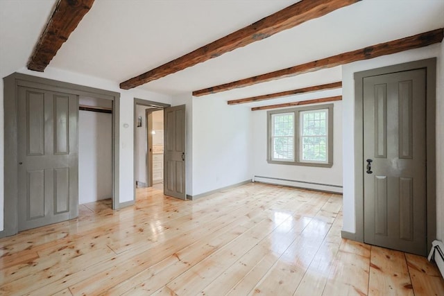 649 S Main St, Raynham, MA 02767 - unfurnished bedroom with baseboard heating, beam ceiling, light wood finished floors, and a closet