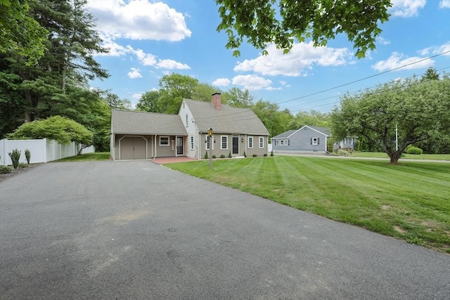 649 S Main St, Raynham, MA 02767 - view of front of property featuring asphalt driveway, an attached garage, and a chimney