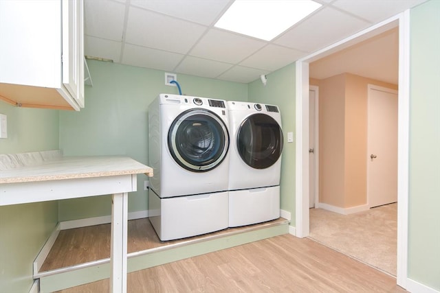 649 S Main St, Raynham, MA 02767 - laundry room with light wood-type flooring, washing machine and clothes dryer, and baseboards