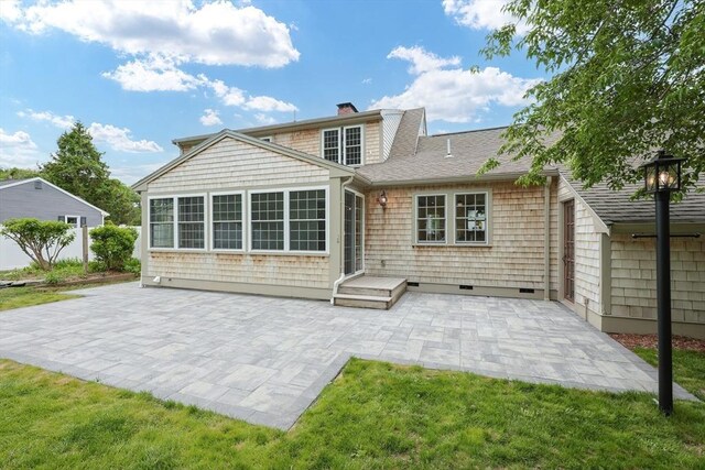 649 S Main St, Raynham, MA 02767 - rear view of property featuring a patio, a shingled roof, a chimney, and a yard