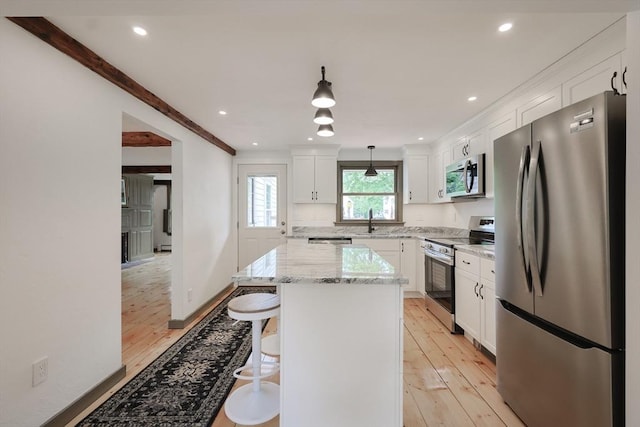 649 S Main St, Raynham, MA 02767 - kitchen featuring appliances with stainless steel finishes, light wood-type flooring, white cabinetry, recessed lighting, and crown molding