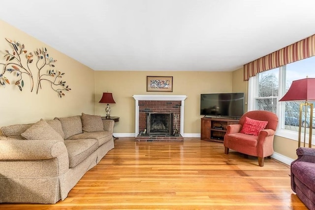 living room featuring a fireplace and hardwood / wood-style flooring