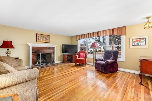 living room with a fireplace and hardwood / wood-style flooring