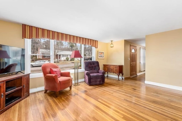 sitting room with light hardwood / wood-style flooring