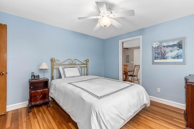 bedroom featuring ceiling fan and hardwood / wood-style floors