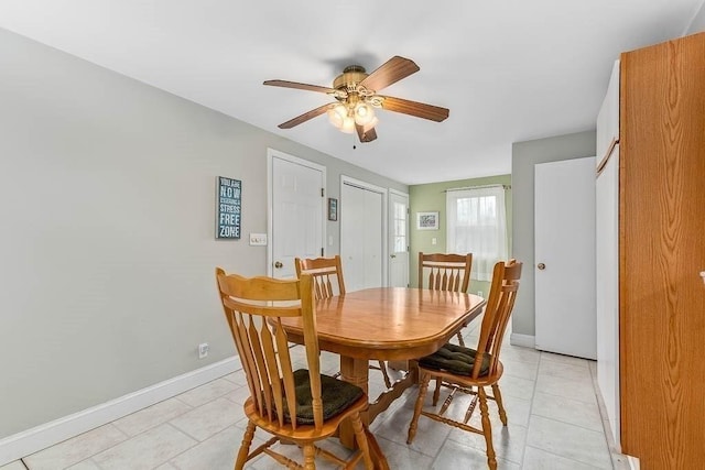 dining room with ceiling fan and light tile patterned flooring