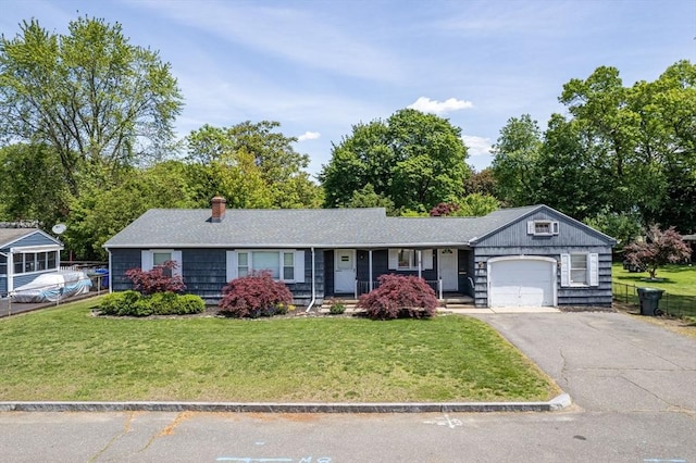 59 Kulig St, Springfield, MA 01104 - single story home featuring a garage, a front yard, driveway, and a chimney