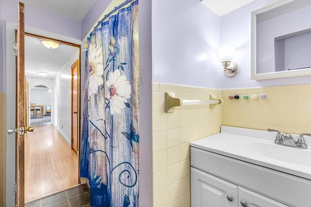 59 Kulig St, Springfield, MA 01104 - bathroom with tile walls, vanity, and a shower with shower curtain