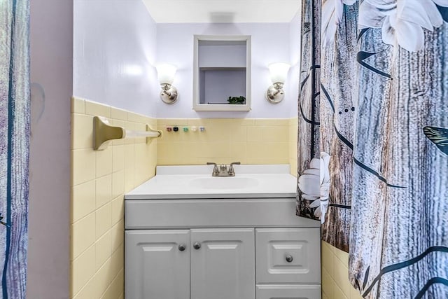 59 Kulig St, Springfield, MA 01104 - bathroom with tile walls, vanity, and wainscoting
