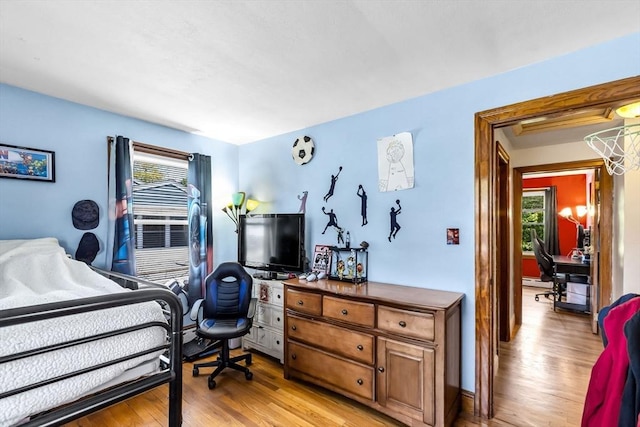 59 Kulig St, Springfield, MA 01104 - bedroom featuring multiple windows, a desk, and light wood-type flooring
