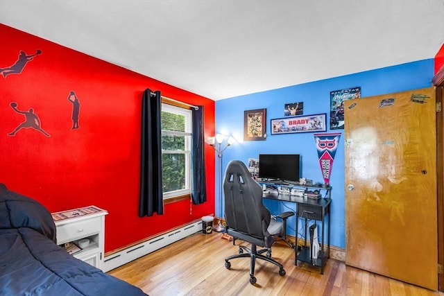 59 Kulig St, Springfield, MA 01104 - home office with baseboard heating, wood finished floors, and baseboards