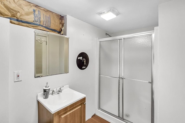 59 Kulig St, Springfield, MA 01104 - full bathroom with vanity, a stall shower, and wood finished floors