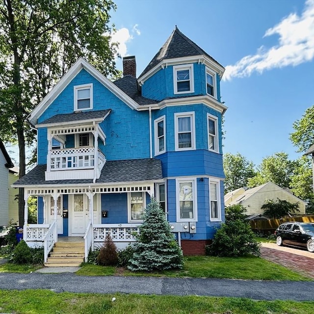 49 Euclid Ave, Springfield, MA 01108 - victorian house with a porch, roof with shingles, and a chimney