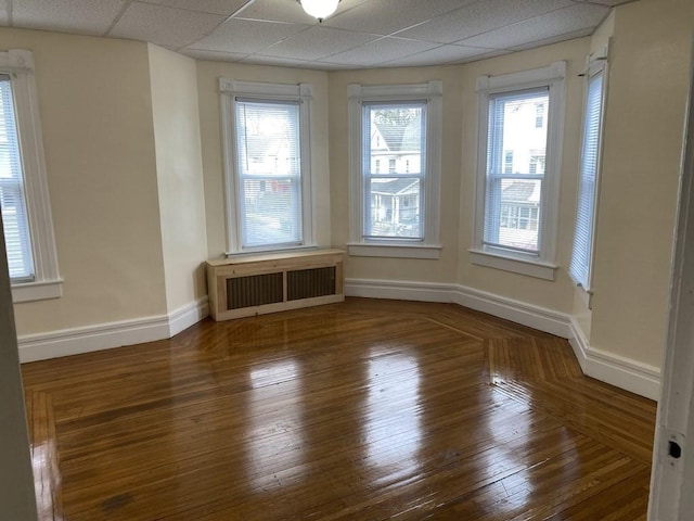 49 Euclid Ave, Springfield, MA 01108 - unfurnished room with radiator, hardwood / wood-style floors, baseboards, and a drop ceiling