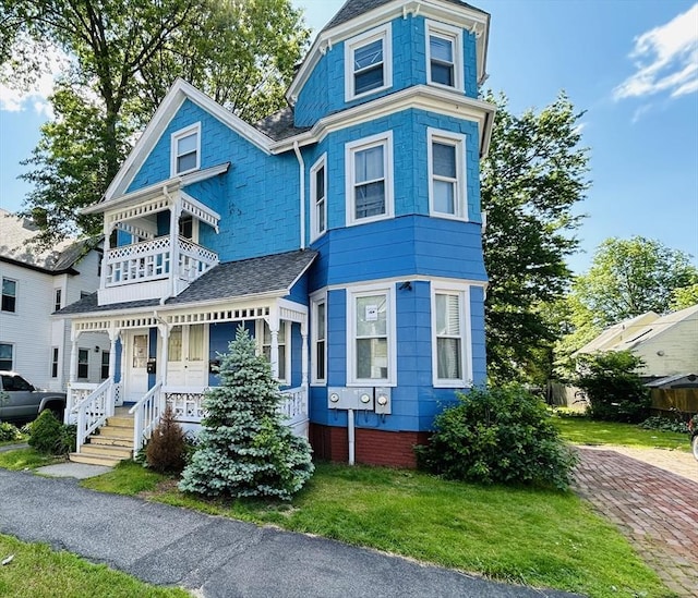 49 Euclid Ave, Springfield, MA 01108 - victorian-style house with a porch, a balcony, and a shingled roof