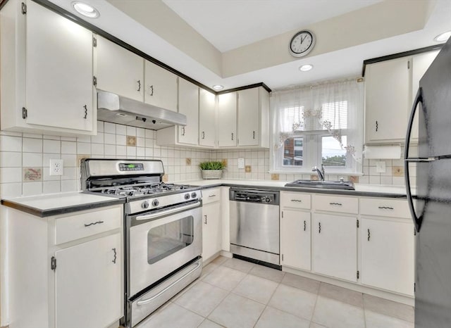 131 Beacon St Unit 4, Chelsea, MA 02150 - kitchen featuring stainless steel appliances, under cabinet range hood, a sink, decorative backsplash, and recessed lighting