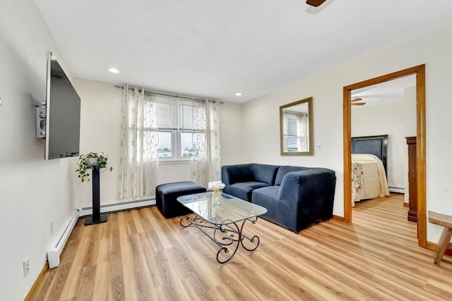 131 Beacon St Unit 4, Chelsea, MA 02150 - living room with light wood finished floors, recessed lighting, baseboards, a baseboard heating unit, and baseboard heating