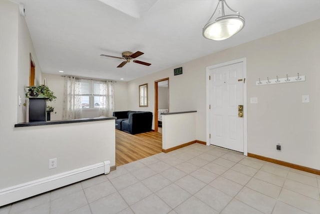 131 Beacon St Unit 4, Chelsea, MA 02150 - entryway with a baseboard heating unit, ceiling fan, baseboards, and recessed lighting