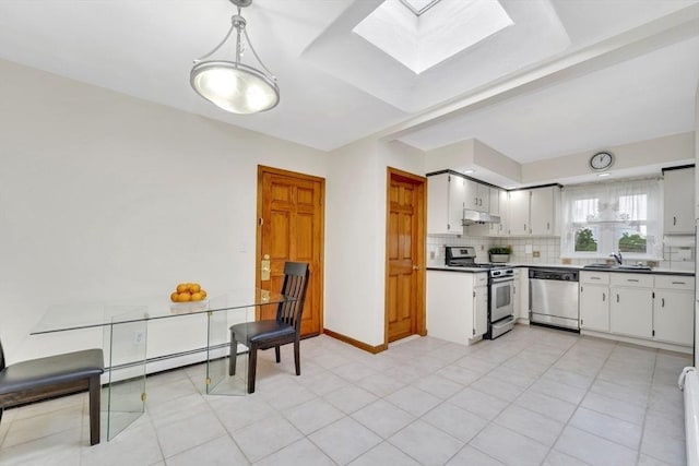 131 Beacon St Unit 4, Chelsea, MA 02150 - kitchen with appliances with stainless steel finishes, a skylight, a sink, under cabinet range hood, and tasteful backsplash