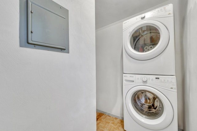 131 Beacon St Unit 4, Chelsea, MA 02150 - laundry area featuring stacked washer and clothes dryer and electric panel