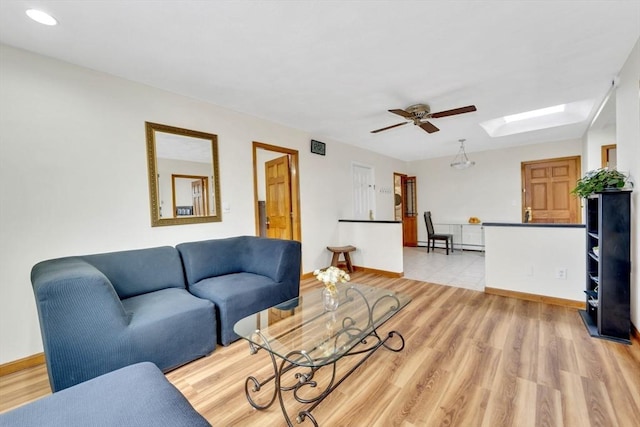 131 Beacon St Unit 4, Chelsea, MA 02150 - living area with a skylight, a ceiling fan, light wood finished floors, baseboards, and recessed lighting
