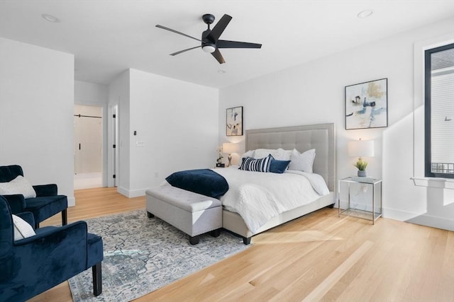 bedroom featuring hardwood / wood-style flooring and ceiling fan