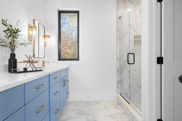 bathroom featuring vanity and a shower with shower door