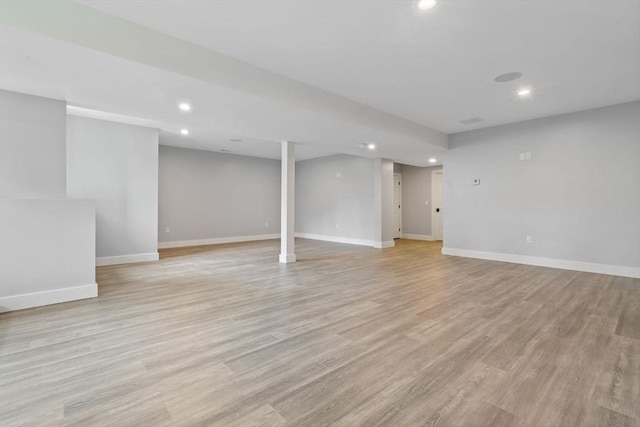 basement featuring light wood-type flooring