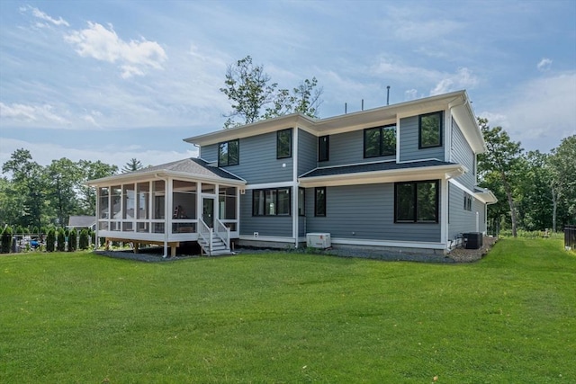 back of property with cooling unit, a yard, and a sunroom