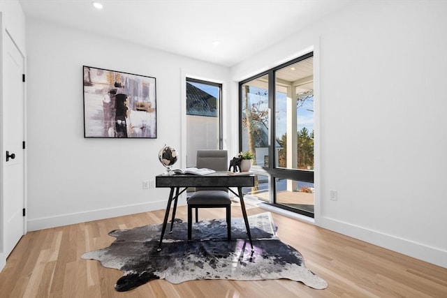 home office with wood-type flooring