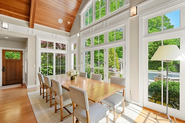 sunroom / solarium with vaulted ceiling, french doors, and wooden ceiling