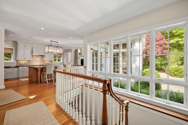 interior space featuring recessed lighting, wood finished floors, and a healthy amount of sunlight