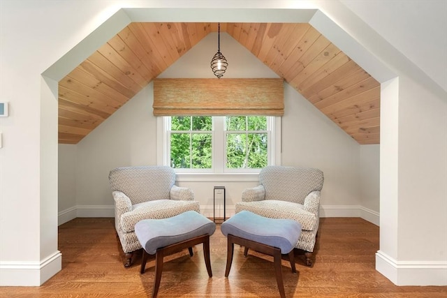 living area featuring vaulted ceiling, wood ceiling, baseboards, and wood finished floors