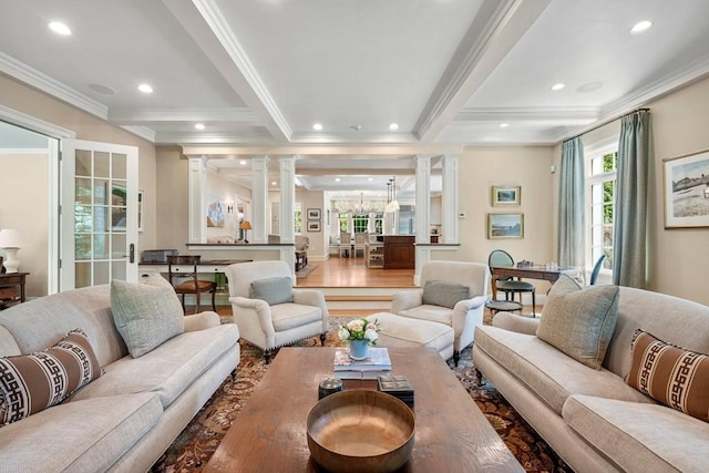 living room with ornate columns, an inviting chandelier, recessed lighting, ornamental molding, and beamed ceiling