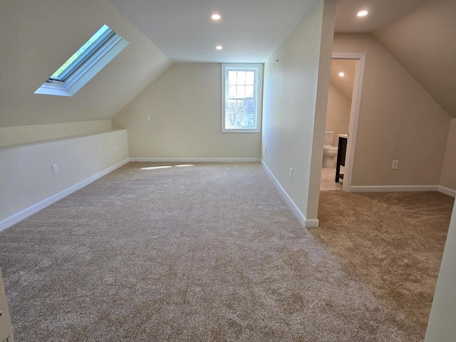 bonus room with recessed lighting, carpet floors, baseboards, and lofted ceiling with skylight