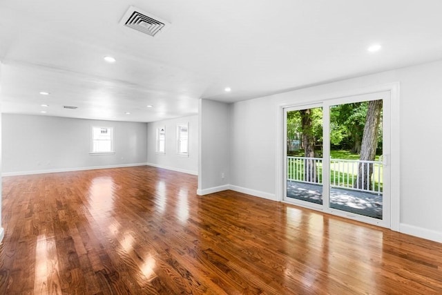 interior space with recessed lighting, visible vents, baseboards, and wood finished floors