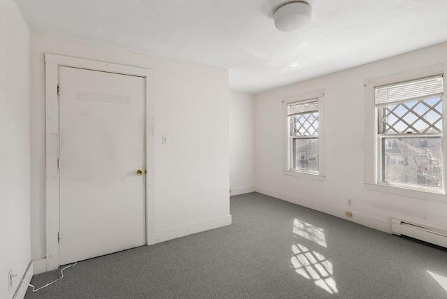 113 Belmont St, Belmont, MA 02478 - spare room with carpet flooring, a baseboard radiator, and baseboards