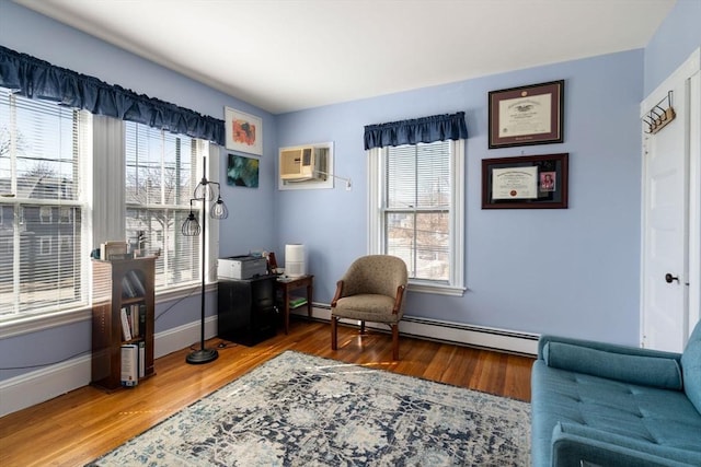 113 Belmont St, Belmont, MA 02478 - living area featuring a wall mounted air conditioner, wood finished floors, and baseboards