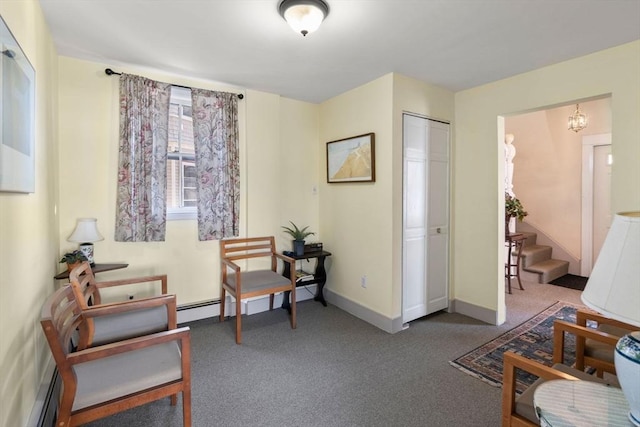 113 Belmont St, Belmont, MA 02478 - sitting room with carpet floors, a baseboard heating unit, baseboards, and stairway