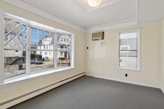 113 Belmont St, Belmont, MA 02478 - spare room featuring a baseboard radiator, a wall mounted AC, carpet floors, and baseboards