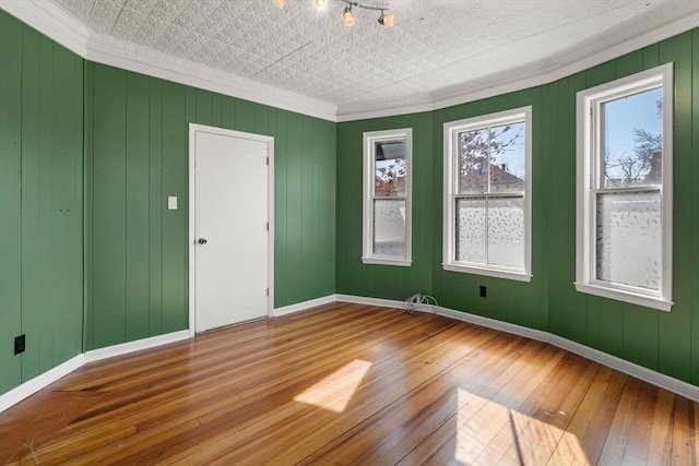 113 Belmont St, Belmont, MA 02478 - unfurnished room with wood-type flooring, ornamental molding, and baseboards