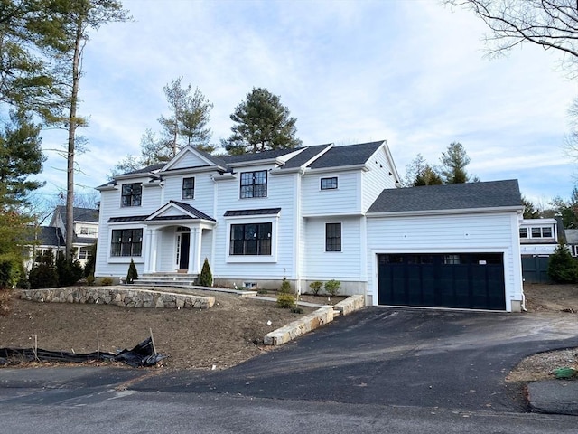 view of front of property featuring a garage and driveway