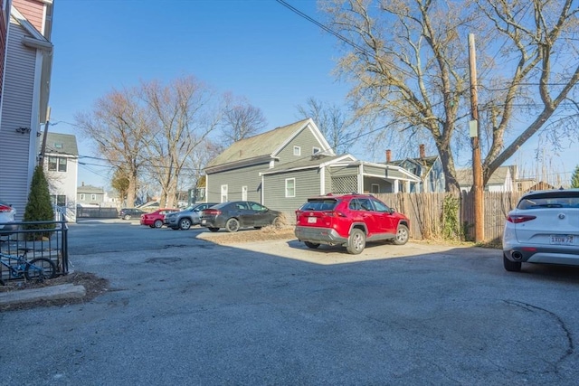 uncovered parking lot with fence