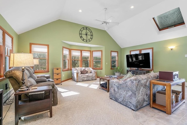 carpeted living area with high vaulted ceiling, recessed lighting, ceiling fan, and baseboards