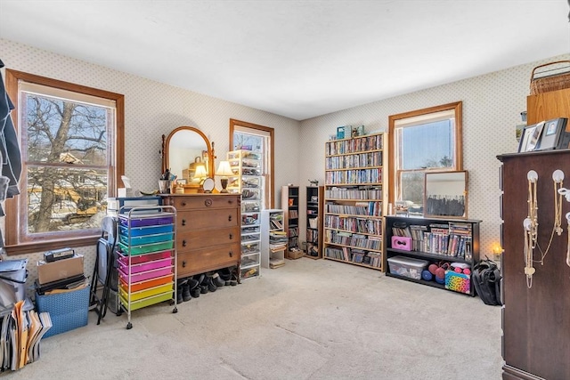 interior space with carpet flooring and wallpapered walls